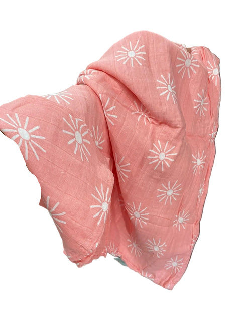 Pink blanket with white floral patterns