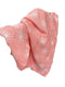 Pink blanket with white floral patterns