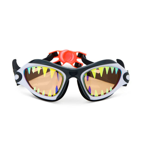 Children's swim goggles with a shark design on a white background