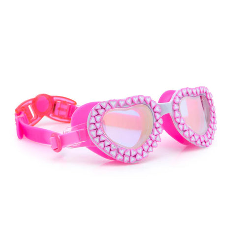 Pink swim goggles with heart-shaped lenses on a white background
