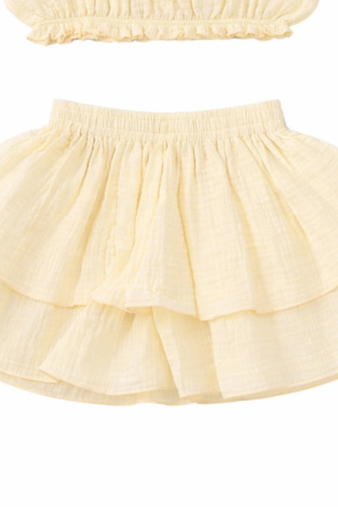 Close-up of the Hawaii Ruffle Set two-tier ruffle skirt in yellow cotton with elastic waist | Bali Bubs
