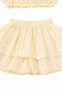 Close-up of the Hawaii Ruffle Set two-tier ruffle skirt in yellow cotton with elastic waist | Bali Bubs