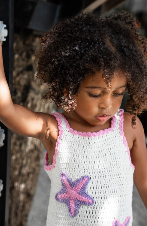white and pink handmade crochet dress with starfish bali eco kids brand.