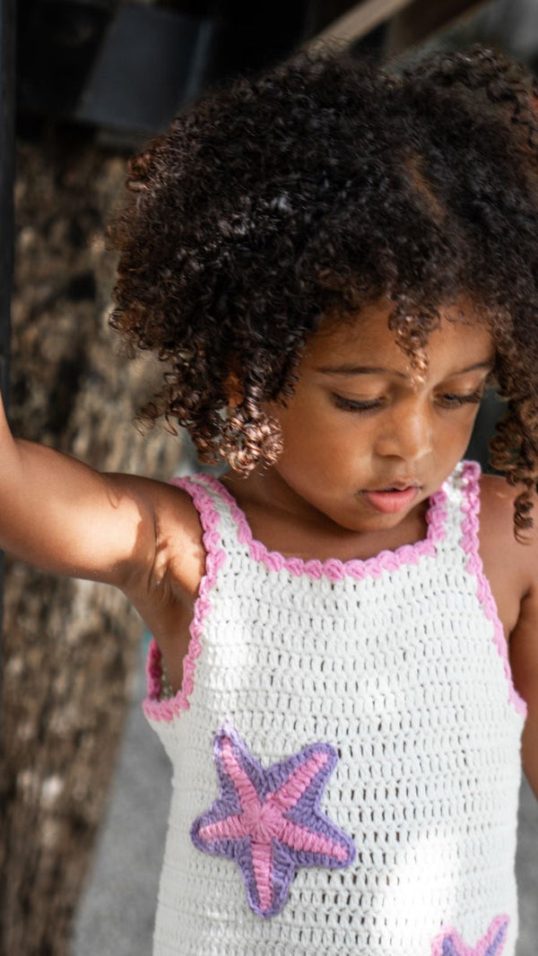 white and pink handmade crochet dress with starfish bali eco kids brand.