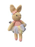 Hand-crocheted bunny toy with a pink dress on a white background