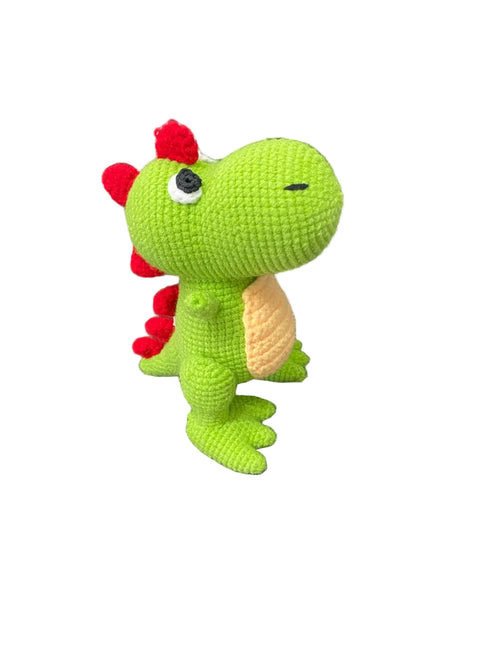 Green crochet dragon toy on a white background