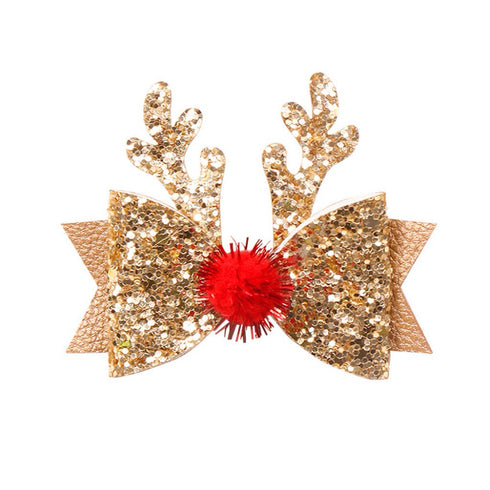 Gold glitter reindeer antlers with a red pom-pom on a white background