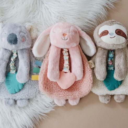 Baby with the Itzy Lovey Pink Bunny plush teether