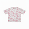 White t-shirt with pink palm tree pattern on a white background