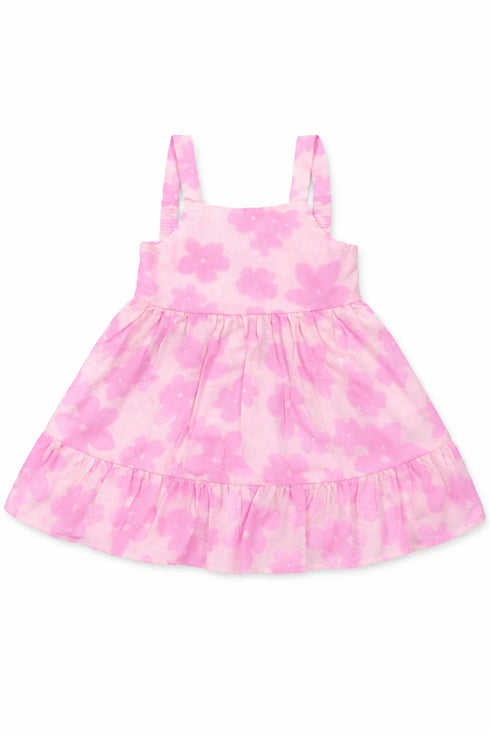 Pink tie-dye dress with ruffled skirt on a white background