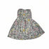 A sleeveless dress with a colorful pink, yellow, and green floral prinT