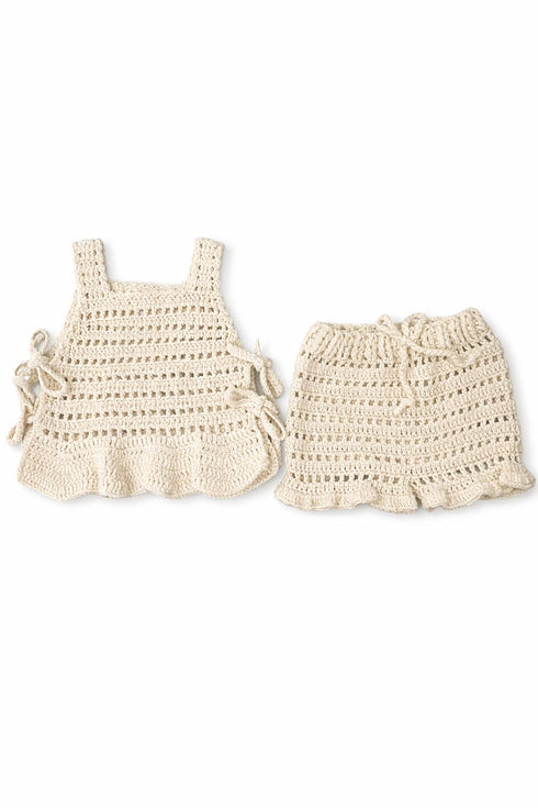 Beige crochet kids outfit handmade in Indonesia by talented artisans.