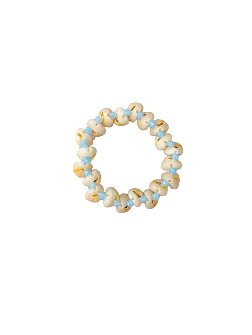 shell bracelet on white background