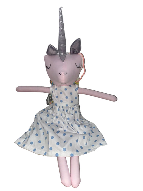 Unicorn plush toy with a polka dot dress