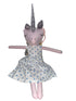 Unicorn plush toy with a polka dot dress