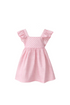 Pink checkered dress on a wooden hanger against a white background