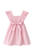 Pink checkered dress with a bow on a wooden hanger against a white background