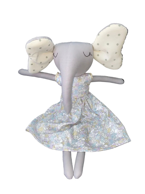 Stuffed toy elephant with a floral dress