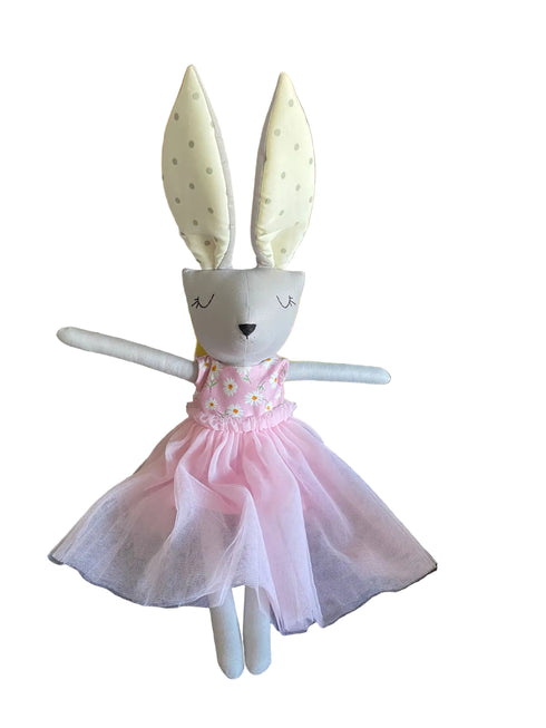 Stuffed toy rabbit in a pink dress