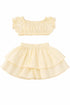 Two-piece outfit with a bandeau top and ruffled skirt on a white background
