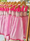 Pink dress with crochet details on the chest