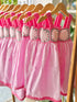 Pink dress with crochet details on the chest