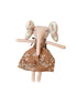A handmade fabric doll with long floppy ears and a brown dress with white floral print.