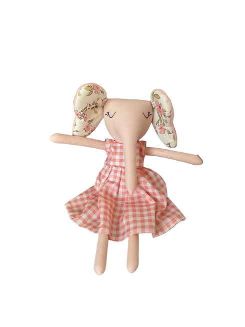 A handmade fabric doll with a pink and white gingham dress and floral-patterned ears.