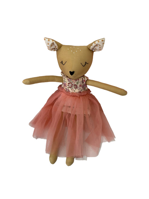 A plush stuffed toy deer doll wearing a pink tutu dress.
