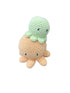 Crocheted turtle toy on white bedground