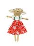 Toy deer in a red dress with white patterns on a white background