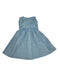 A light blue sleeveless dress with white polka dots