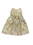 Floral dress with yellow and purple pattern on a white background