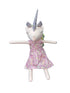 Stuffed unicorn toy with a pink dress
