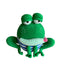 Crocheted green frog toy with a striped shirt on a reflective surface