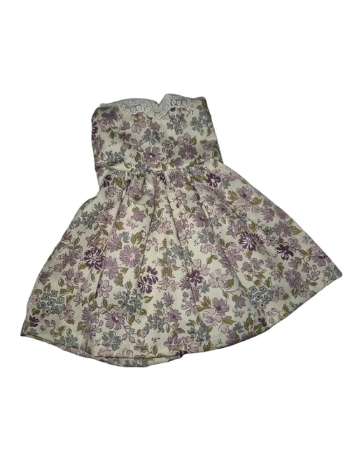 A sleeveless floral dress with a pleated skirt and lace neckline