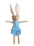Stuffed bunny toy with a blue dress