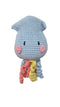 A handmade crocheted octopus plush toy. The octopus has a light blue body, pink cheeks, and wavy tentacles in yellow, orange, and pink.