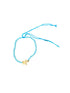 Bracelet with a star charm on a textured surface