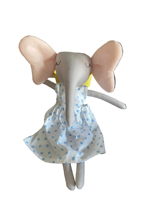 Stuffed elephant toy in a polka dot dress