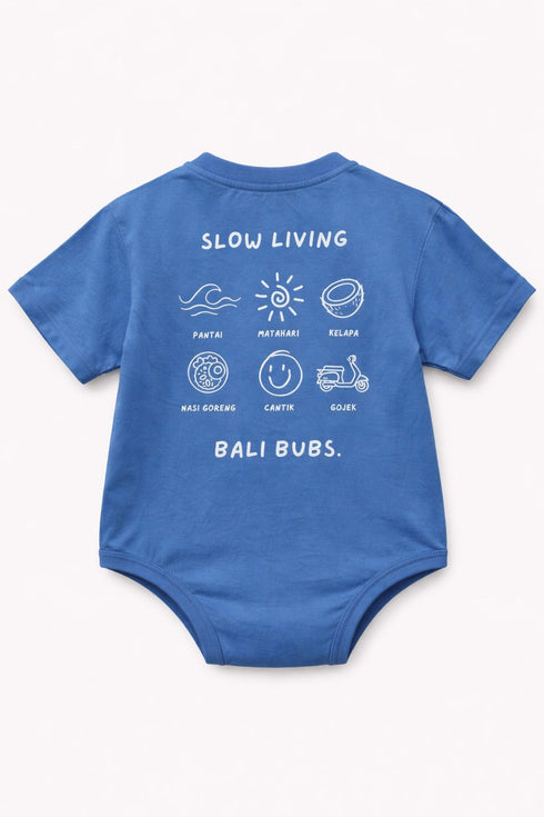 Blue baby onesie with white text and graphics on a white background