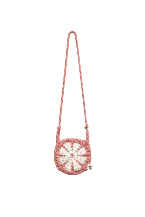 Pink beaded handbag with a circular design on a white background