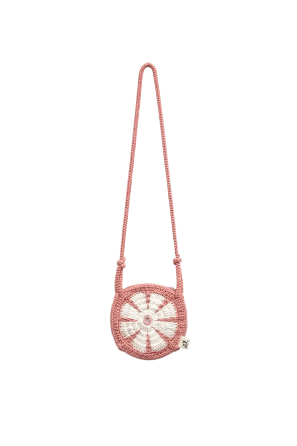 Pink beaded handbag with a circular design on a white background