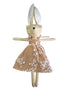 A handmade plush bunny doll with long ears, wearing a tan dress with a white floral pattern.