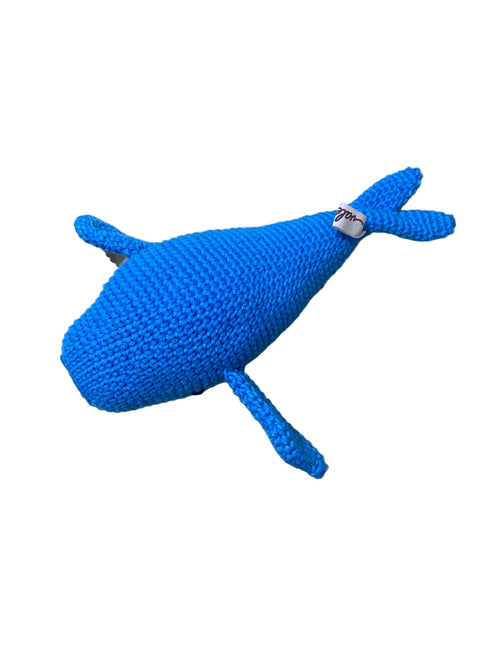 Blue knitted whale toy on a white background