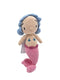 A handmade crocheted mermaid doll with a beige face and torso, a pink tail, and blue hair, standing against a plain white background.