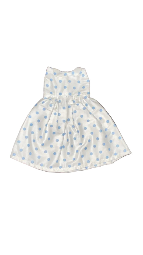 White dress with blue polka dots on a white beground
