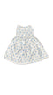 White dress with blue polka dots on a white beground