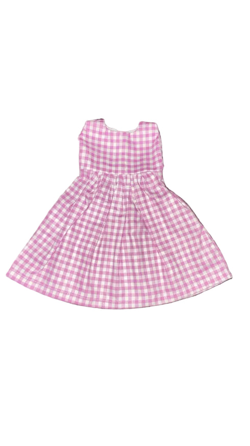 Pink and white checkered dress on a white beground