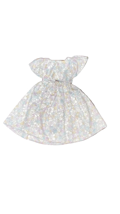 White dress with bow on a white beground